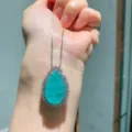 Pear-shaped turquoise gemstone pendant necklace with silver chain and dazzling cz halo. - Pendant Only