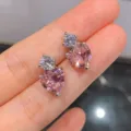 Vergoldete rosa Herz Zirkonia Ohrstecker mit funkelnden runden klaren Steinen Damen. - Ohrstecker