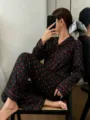 Detail shot of women's black and red heart print long sleeve pajama set for cozy home. - S / Top And Bottom / Black Red Heart