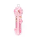 Soft bristle adult toothbrush with pink cherry blossom handle and clean packaging. - Pink