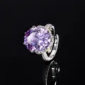 Close-up detail of luxury oval purple gemstone ring with sparkling paved diamond band. - Adjustable Open / Purple Blue Ring