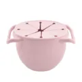 Pink silicone baby snack cup with dual handles and spill proof lid for toddlers outdoors. - Pink