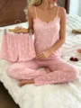 Detailed shot of pink heart-print camisole and pants pajama set with lace trim details. - S / Pink White