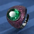 Detailed view of a bold chunky oval green gemstone ring with pink pavé stones in black gold. - Oval Main Stone (ZS1149 Black Gold) / Black Gold Green Rhinestone Ring