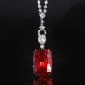 Detailed close-up view of the luxurious red gemstone pendant necklace with sparkling diamonds. - White Gold Orange Red Pendant With Versatile Chain