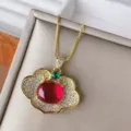 Gold plated ruyi lock pendant necklace featuring red and green crystal details in detail view. - Gold Red Corundum Pendant (With Chain)