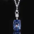 Luxurious blue cushion cut synthetic gemstone pendant necklace with dazzling cubic zirconia details. - White Gold Blue Pendant With Versatile Chain