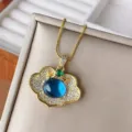 Exquisite gold plated copper ruyi lock pendant necklace with sparkling blue gemstone details. - Gold Blue Spinel Pendant (With Chain)