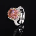 Luxury cushion cut pink zircon ring with shimmering pave halo set in gold plated copper. - Orange-Pink Ice Cut Rhinestone Ring