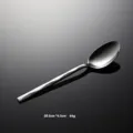 Stainless steel spoon handle detail, featuring a sleek geometric diamond pattern and mirror polished finish. - Dinner Spoon Only