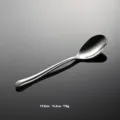 Stainless steel spoon detail view, elegant polished surface and smooth curved handle design. - Dinner Spoon Only