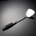Stainless steel spatula handle detail closeup, durable kitchen cooking tool showcase. - Turner Spatula