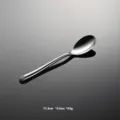 Stainless steel flatware dinner spoon detail view, elegant curved handle design, 17.3cm length. - Tea Spoon