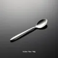 Stainless steel spoon detail view, polished metallic texture, high quality 304 material. - Tea Spoon
