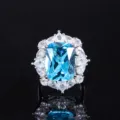 Retro simulated blue topaz cushion cut ring with sparkling diamond cluster detail - Ring / Topaz Blue