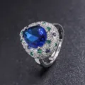Anello vintage con pietra blu sintetica a goccia e alone di zirconi cubici colorati donna. - Anello Regolabile in Zaffiro Blu