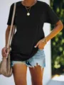 Detailed view of casual solid black short sleeve t-shirt paired with denim shorts. - S / Black