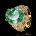 Vintage gold-plated ring featuring a large oval green gemstone and pave cubic zirconia. - Oval Vintage Style / Adjustable / Paraiba Green Ring