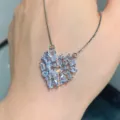Detail view of a stunning heart-shaped crystal cluster pendant necklace on silver chain. - Pendant / Silver