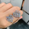 Detailed view of sparkling cubic zirconia heart stud earrings, elegant bridal jewelry. - Stud Earrings / Silver