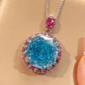 Élégant collier de pierres précieuses bleu mer taille millénaire avec détail rubis éclatant. - Collier Pendentif Bleu Mer (Avec Chaîne Chopin) (ZS1313) / Aigue-marine