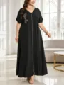 Plus size black maxi dress with leaf embroidery, V-neck, short sleeves, and loose fit. - Black