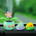 Cute solar powered flower pot and sleeping animal car dashboard ornaments for decor. - Three Small Flowers + Dinosaur + Duck 4-Piece Set / Mint Green