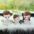 Cute cartoon family car dashboard doll ornament set with white feathers and mini potted flower decor. - Yoga Dad, Mom, Son & Peace Flower with Large Feather
