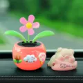 Cute solar dancing flower and sleeping pig car dashboard ornament for cute interior decor. - Three Small Flowers + Little Pig 3-Piece Set / Grapefruit Red