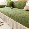 Green embossed sofa cover with beige pleated skirt, elegant elastic furniture protector for living room. - Wuhua Ruffle - Green