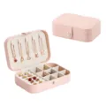 Portable travel jewelry box in pink leather with compartments for rings, earrings and necklaces. - Pink