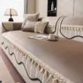 Luxurious beige ice silk sofa cover with elegant tassels and anti-slip design for modern home. - 70*70cm / Champagne