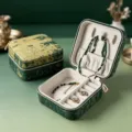 Portable travel jewelry box with green fabric exterior and soft velvet interior compartments. - 10*10*5cm / Gold Green