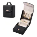 Portable black leather jewelry box with compartments for rings, necklaces, and travel use. - Black