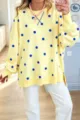 Details of the women's loose polka dot sweatshirt with long sleeves and side splits. - S / Yellow