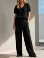 Conjunto casual negro de punto gofrado con top de cuello en V y pantalón ancho. - XS / Negro
