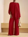 Detalle del conjunto rojo con top asimétrico y pantalón ancho de estilo muy elegante. - S / Top y Pantalones / Negro