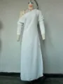 White long sleeve knit dress detail showing asymmetric neckline, side slit and delicate fabric texture. - As Shown