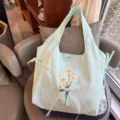 Light green nylon shoulder bag with cute floral embroidery and white lace bow detail for women. - Mint Green Lace Bowknot Flower Vest Bag