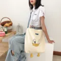 Canvas shoulder bag with cute cartoon duck design, large capacity casual tote bag. - Cute Heart Duck Blue Strap Crossbody Bag