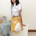 Yellow canvas shoulder bag with cute white goose graphic and large capacity for casual daily use. - Cute What Duck Blue Strap Crossbody Bag