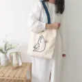 Casual canvas tote bag with cute cat graphic and blue shoulder strap, large capacity daily use. - Cute Naughty Cat Blue Strap Shoulder Bag