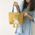 Yellow canvas tote bag with blue handles and cute 3D duck feet design for casual daily use. - Cute What Duck Small Handbag