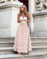 Detailed view of a chic tiered tulle maxi skirt with layered ruffles for a stylish summer look. - S / Pink