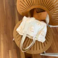 Cream white mini canvas tote bag with 3D rose flowers, versatile portable handbag. - Three-Dimensional Off-White Flower Style