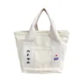 Canvas tote bag with cute cake embroidery, compact lunch handbag for students and daily casual use. - Cake