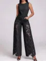 Detailed view of women's sleeveless black denim jumpsuit with elegant lace side cutouts. - S / Black