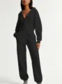 Black zip-up hooded jumpsuit casual long sleeve sweatsuit detail view for daily wear. - XS / Black