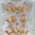 Detail shot of gold-plated pave cubic zirconia hoop earrings neatly packaged on cards. - Double Row Circle Style (ZSJEH735)