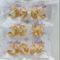 Detail view of wholesale gold plated pave zircon geometric hoop earrings packaged securely. - Hollow Small Circle Style (ZSJEH731)